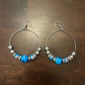Large hoop earrings with blue and silver beads some with rhinestones